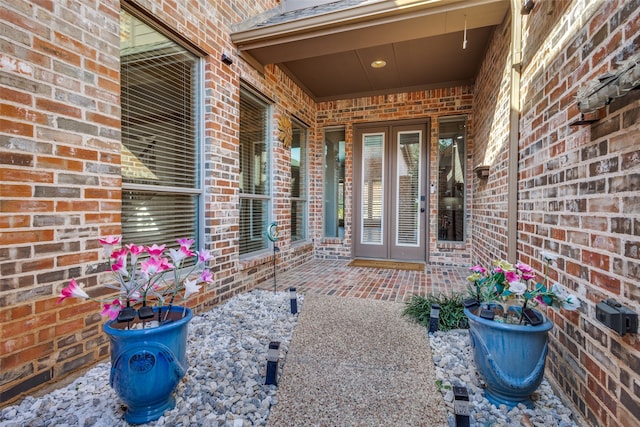 entrance to property with a patio