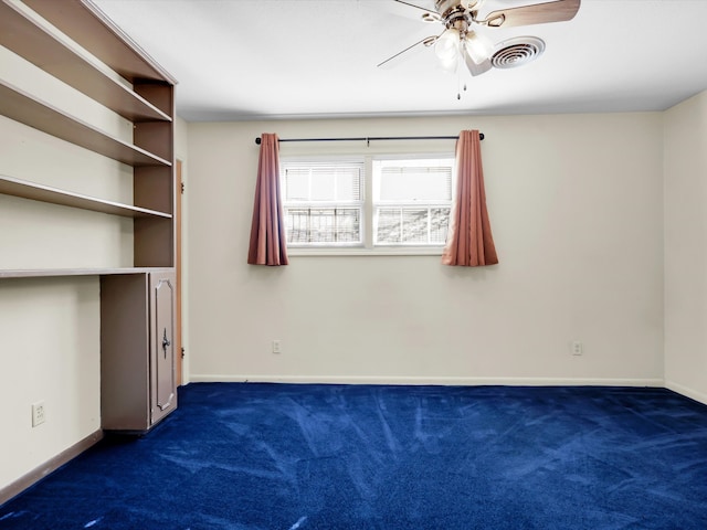 interior space with ceiling fan and dark colored carpet