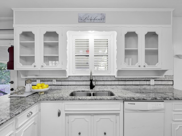 kitchen featuring white cabinetry, backsplash, white dishwasher, and sink