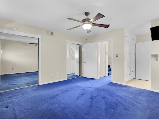 unfurnished bedroom with carpet flooring and ceiling fan