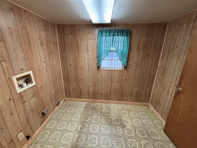 laundry area with wood walls and hookup for a washing machine