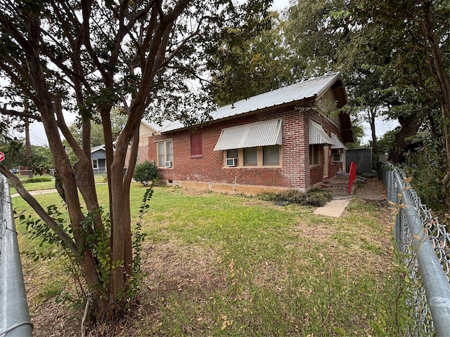 view of property exterior with a yard