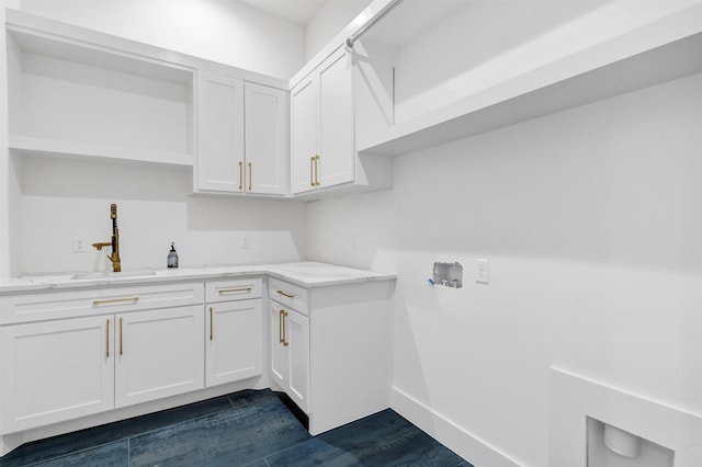 laundry room featuring cabinets, sink, and washer hookup