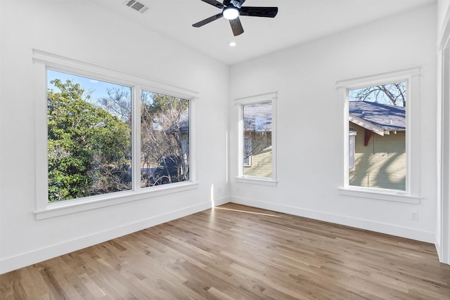 unfurnished room featuring light hardwood / wood-style flooring and ceiling fan