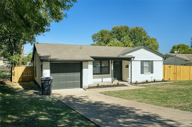 ranch-style house with a garage and a front yard