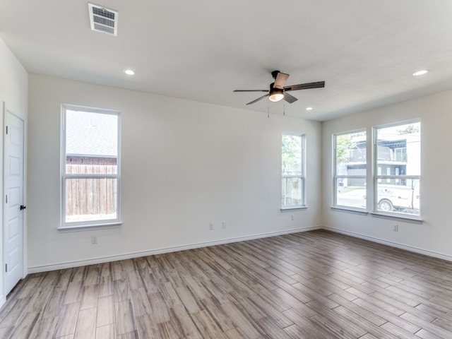 unfurnished room featuring light wood-type flooring and ceiling fan