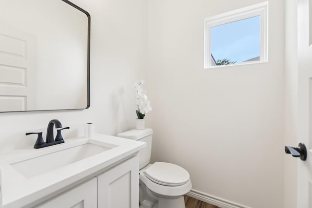 1610 Life Ave, Dallas, TX 75212 - bathroom featuring toilet, vanity, and wood finished floors