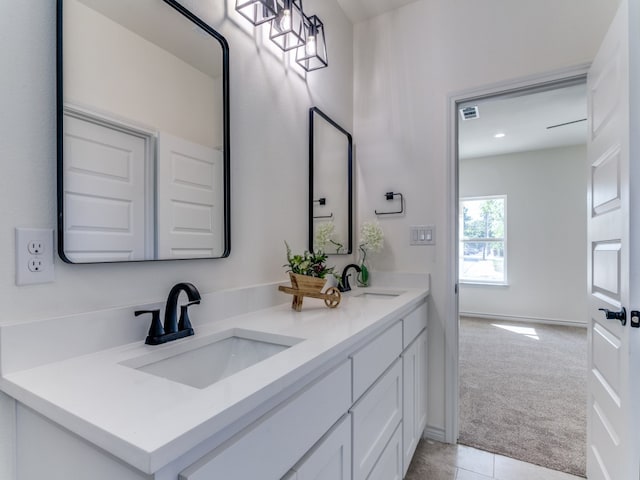 bathroom with vanity and tile patterned flooring