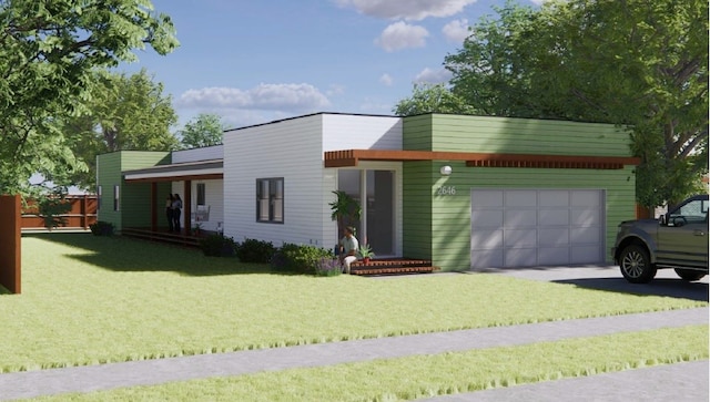 view of front of home featuring a front lawn and a garage