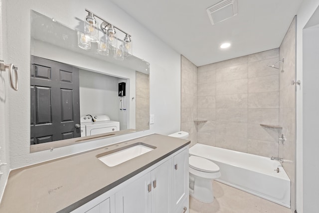 full bathroom featuring vanity, toilet, and tiled shower / bath