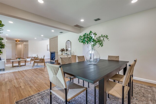 dining space with hardwood / wood-style floors and a wealth of natural light