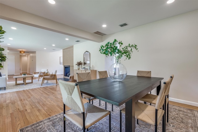 dining space with visible vents, recessed lighting, and light wood finished floors