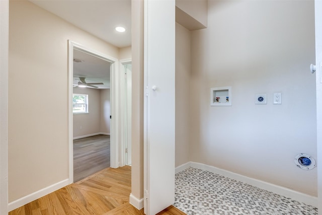 washroom featuring hookup for an electric dryer, hookup for a washing machine, baseboards, laundry area, and wood finished floors
