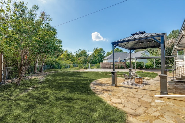 view of yard featuring a gazebo and a patio area