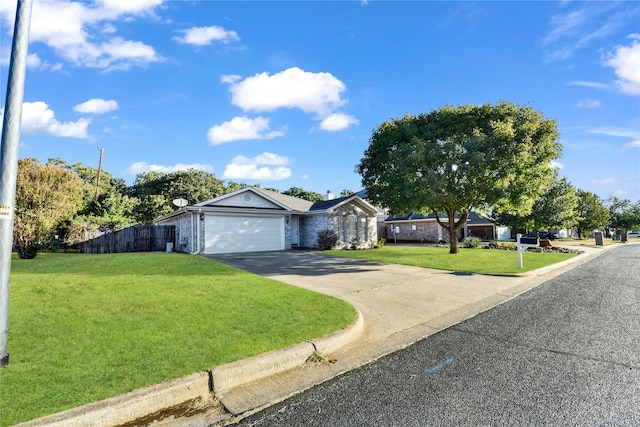 single story home with a front yard and a garage