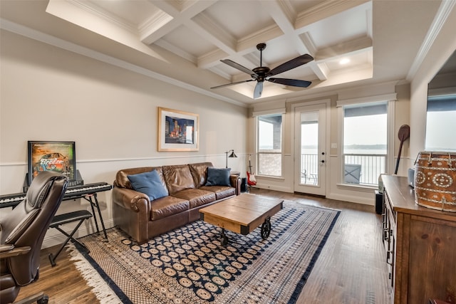 living room with coffered ceiling, wood-type flooring, and ornamental molding