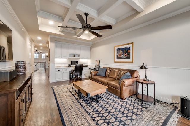 living room featuring beamed ceiling, crown molding, light wood-type flooring, and coffered ceiling