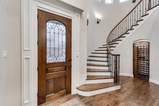 entryway with dark hardwood / wood-style floors