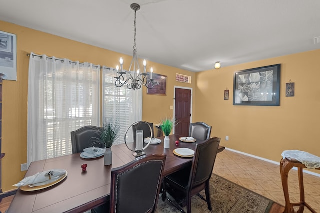 dining space with a notable chandelier