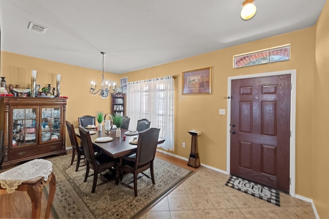 dining space featuring an inviting chandelier