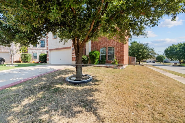 view of front facade with a front yard and a garage