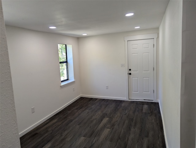 empty room featuring dark hardwood / wood-style floors