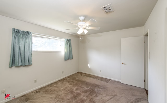 carpeted empty room with ceiling fan