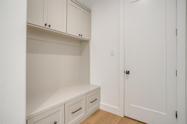 mudroom with light hardwood / wood-style floors