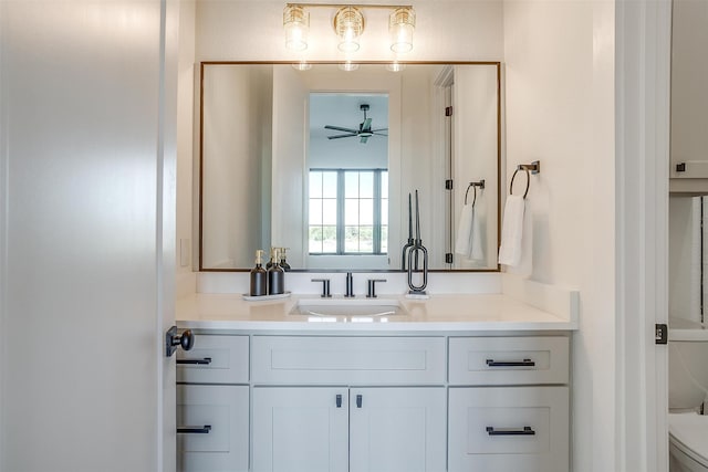 bathroom with ceiling fan, toilet, and vanity