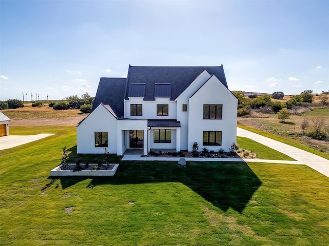 modern farmhouse style home with a front lawn