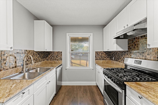 kitchen featuring a textured ceiling, white cabinets, dark hardwood / wood-style flooring, stainless steel appliances, and sink