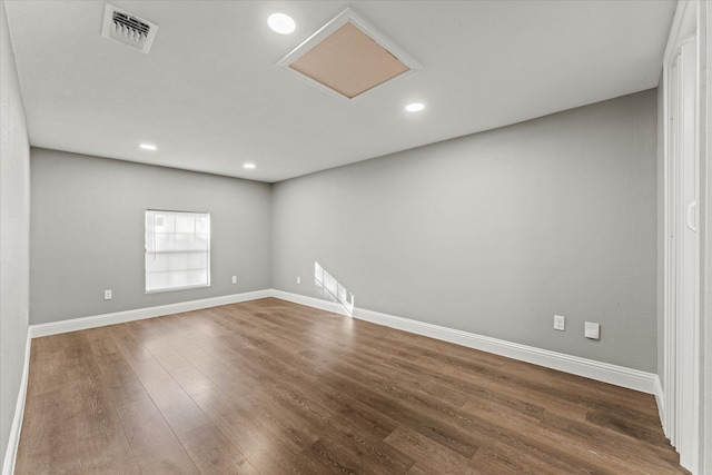 empty room featuring dark hardwood / wood-style flooring