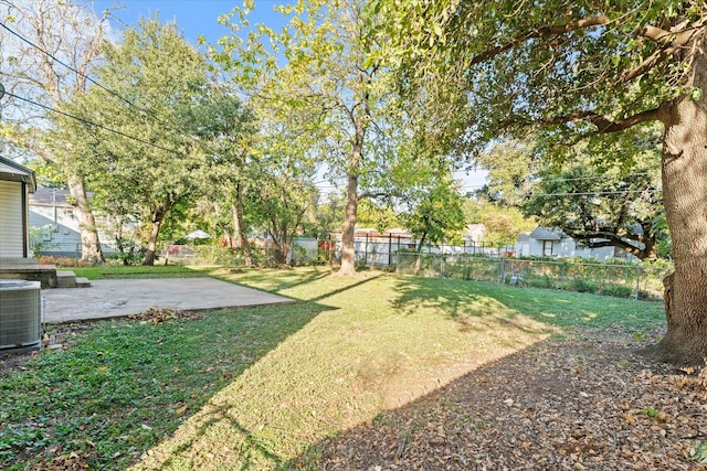 view of yard with a patio and central AC