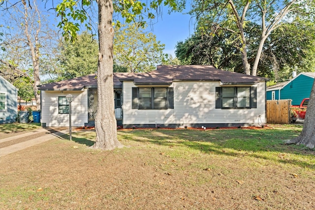 ranch-style home with a front yard