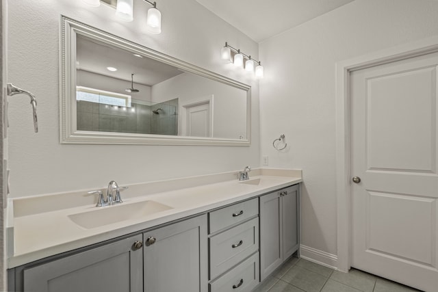 bathroom with vanity, walk in shower, and tile patterned floors