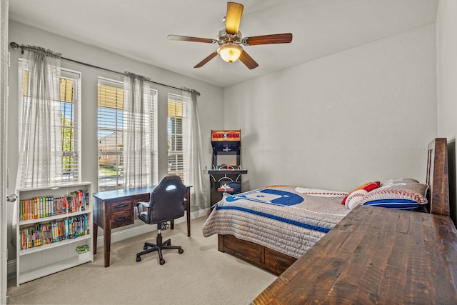 carpeted bedroom with ceiling fan