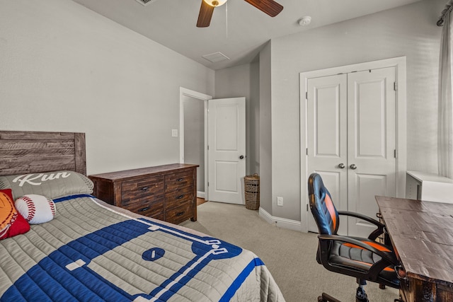 carpeted bedroom with a closet and ceiling fan