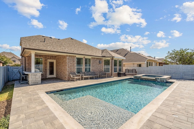 view of pool featuring an in ground hot tub and a patio area