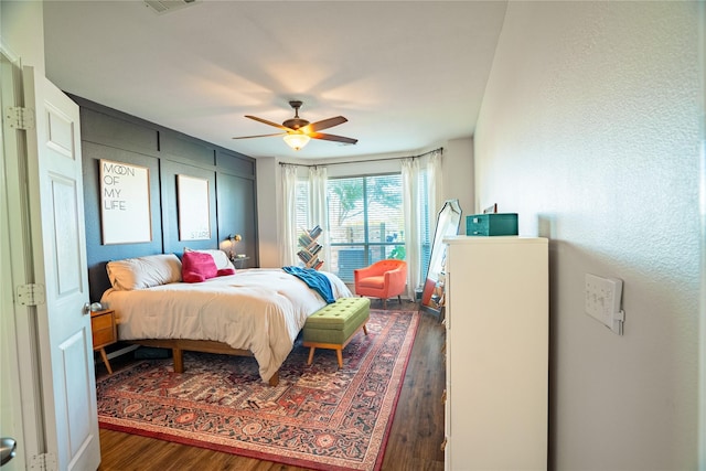 bedroom featuring dark hardwood / wood-style floors and ceiling fan