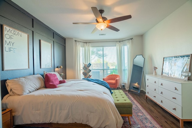 bedroom featuring ceiling fan and dark hardwood / wood-style flooring