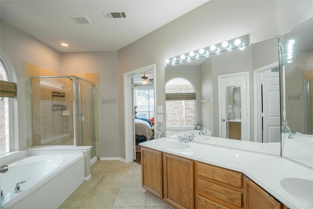 bathroom featuring tile patterned flooring, ceiling fan, separate shower and tub, and vanity