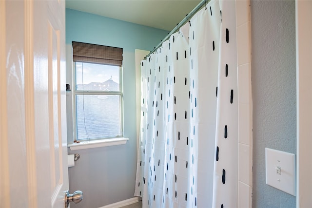 bathroom featuring walk in shower