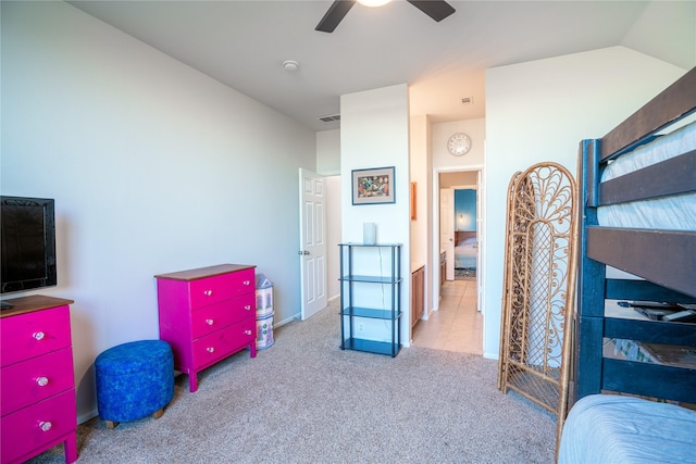 carpeted bedroom featuring ceiling fan and vaulted ceiling