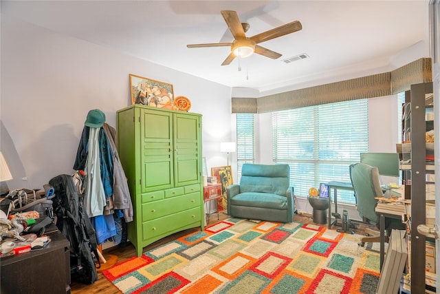 bedroom with ceiling fan and light hardwood / wood-style flooring