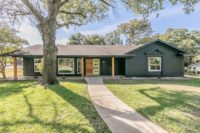 ranch-style home with a front yard