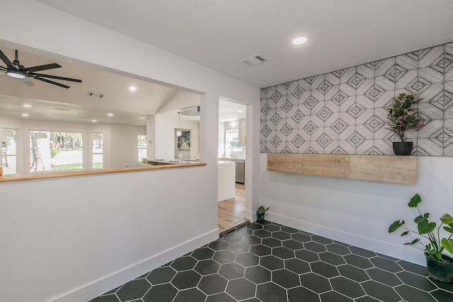 interior space featuring ceiling fan