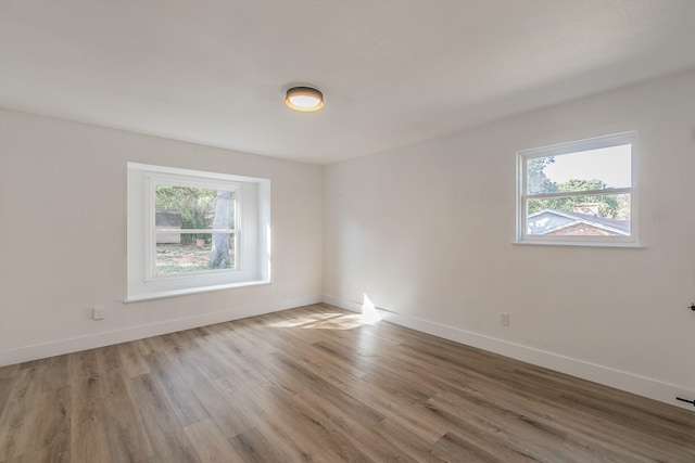 spare room featuring hardwood / wood-style flooring