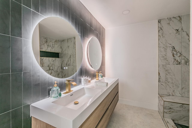 bathroom with tile walls, tile patterned floors, and vanity