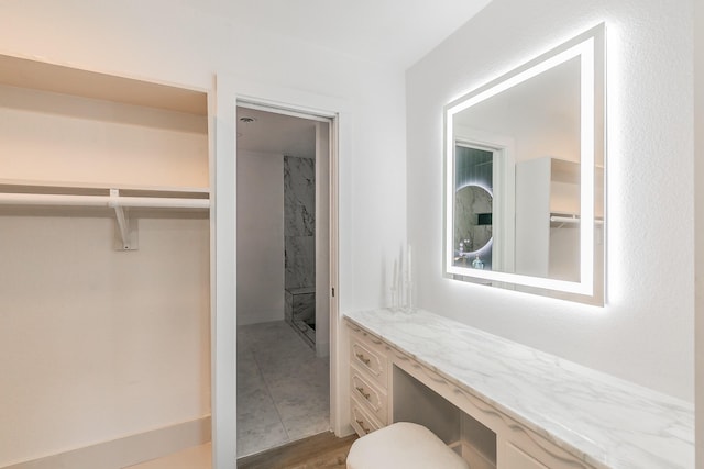 bathroom featuring wood-type flooring and vanity