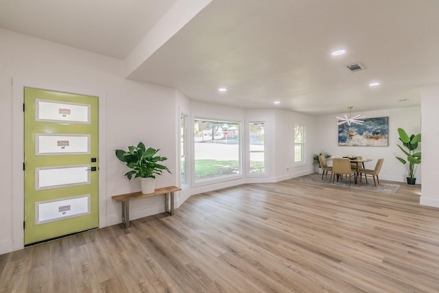 foyer entrance with light wood-type flooring